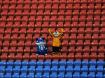 Wigan and Hull mascots stand side-by-side in an empty stand at the BW Stadium in Wigan, a sign that the FA Cup is very much playing second fiddle to the Premier League