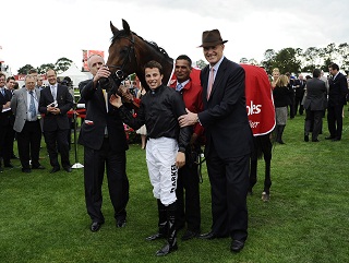 The Masked Marvel team celebrate success in the St Leger