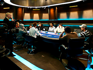 The nine-handed not-quite-final final table at the end of Day 5 of the PCA Main Event (Photo: Joe Giron)