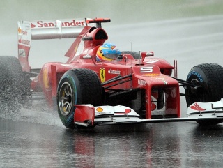Alonso driving through the downpour