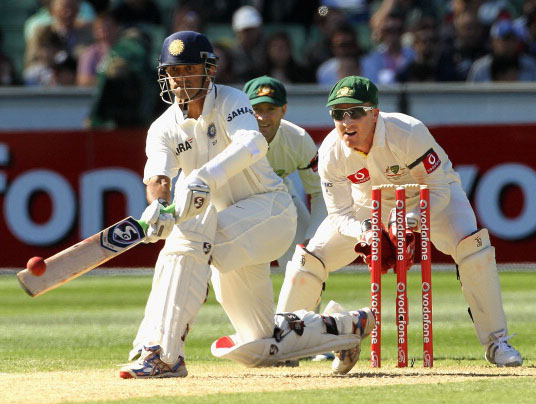 Eyes on the ball. Rahul Dravid sweeps during his last-ever Test series against Australia. 