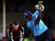 He's all smiles; Dwayne Smith belts another boundary on the way to smashing 59 off 26 balls on Twenty20 finals day at Edgbaston. He was using a Mongoose bat.