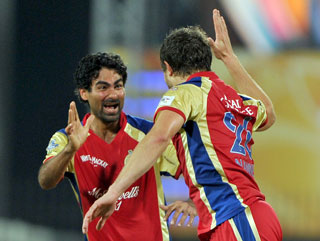 Mohammed Kaif (left) and Dirk Nannes (right) enjoy themselves for Bangalore last year 