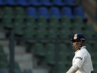 No-one's watching as Sachin Tendulkar leaves the field having scored 94 in last week's Test between India and the West Indies