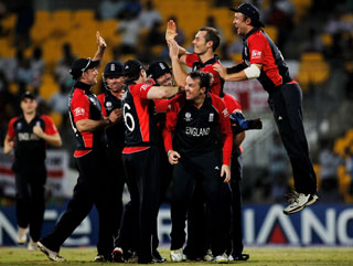 England celebrate the wicket of Kemal Roach as Windies collapse 