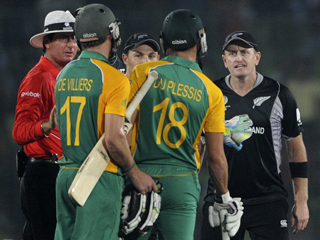 Just not cricket. Worsd are exchanged after the run-out of AB De Villiers. 