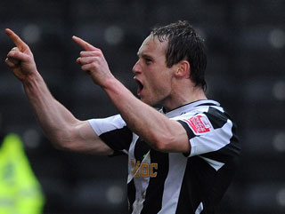 Ben Davies celebrates scoring his favourite goal of the season the