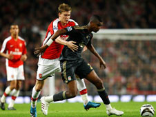 Niklas Bendtner scored the winner as a team of Arsenal youngsters beat Liverpool to book their place in the quarter-finals of the Carling Cup.