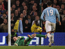 Shay Given dives to the right and denies Frank Lampard as Joleon Lescott looks on...