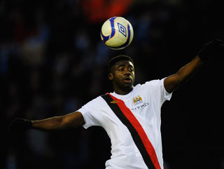 Toure-ing above his opponents. Kolo Toure is a key player for Manchester City