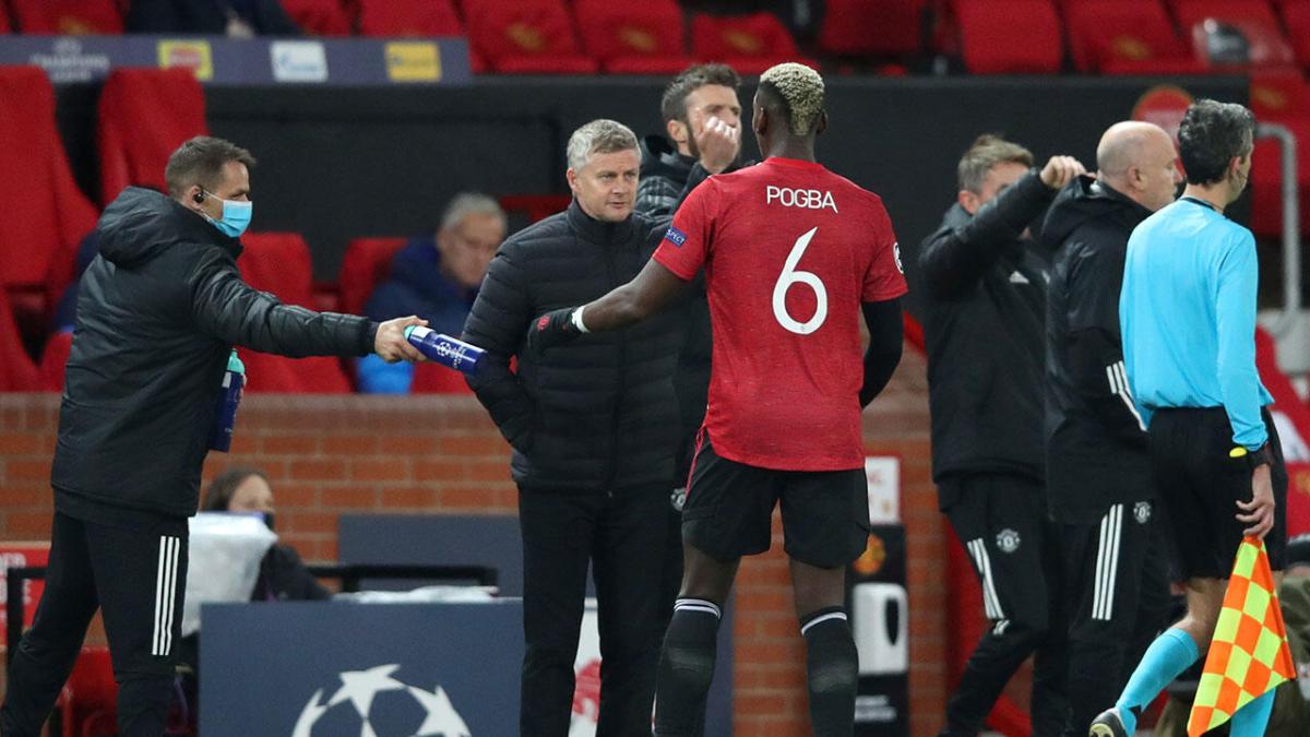 Ole Gunnar Solskjaer talking to Man Utd's Paul Pogba