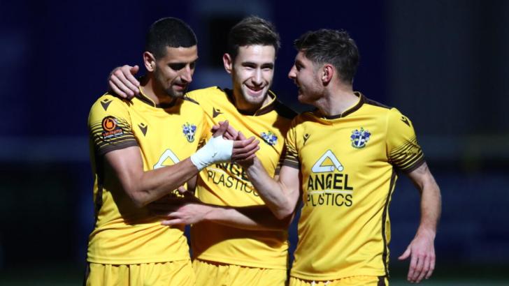 Sutton United players celebrate a goal