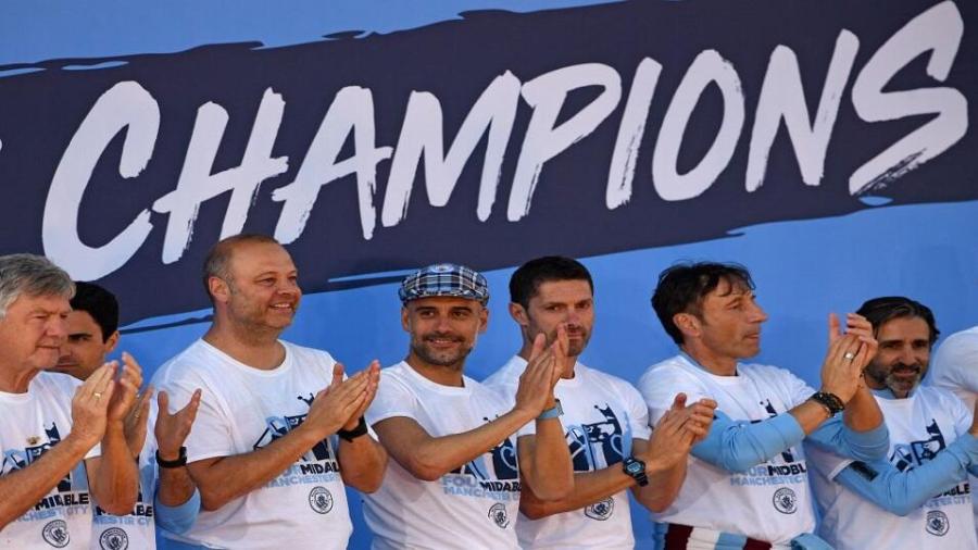 Pep Guardiola and training team.jpg