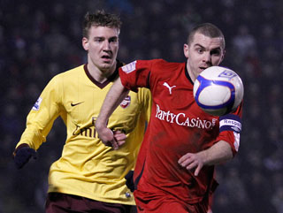 Os captain Stephen Dawson gets ahead of Nicklas Bendtner 