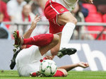A typically non-nonsense tackle from Oxford's Mark Creighton but he's been seriously out of form in recent weeks 