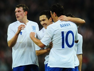 Gareth Barry is congratulated for his part in England’s first-half goal