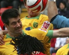 A typical scene of rough and tumble from the Football League.