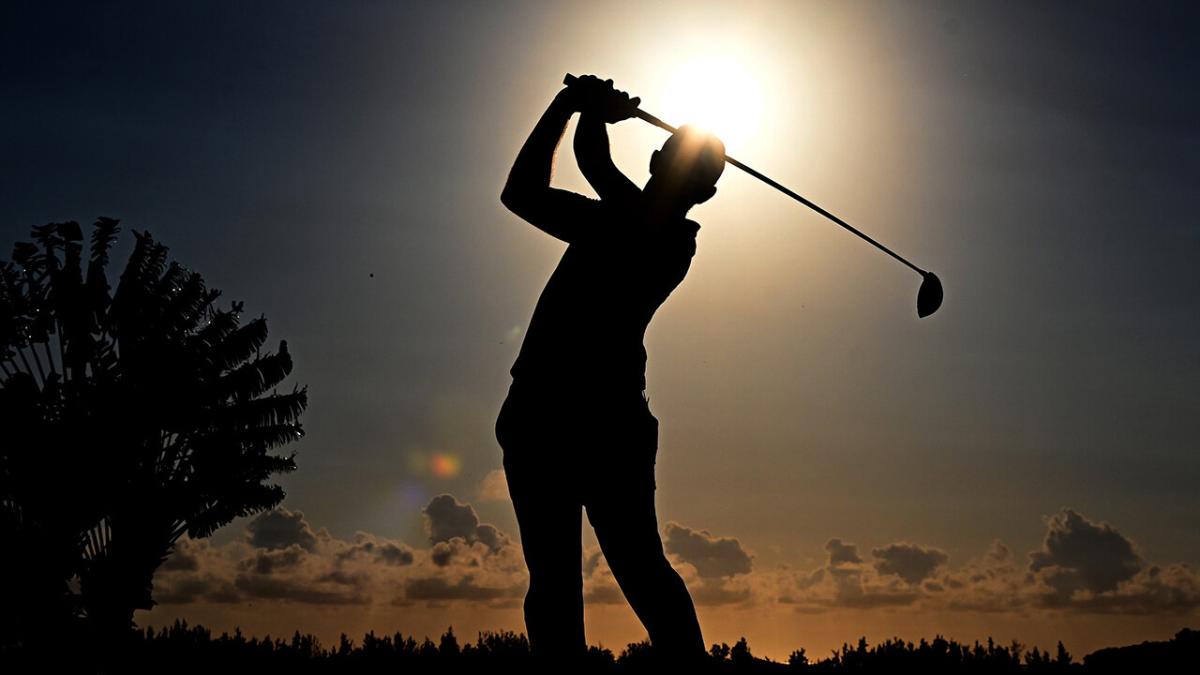 Golfer swinging his driver 