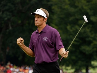 Stuart Appleby reacts to making history with his birdie on the 18th