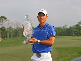 Anthony Kim with his newly acquired Shell Houston Open trophy