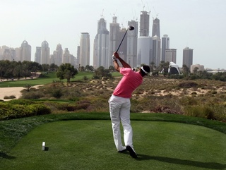 Alvaro Quiros takes aim at the Dubai skyline during last year’s Desert Classic