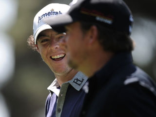 Rory McIlroy and Graeme McDowell share a laugh during a practice round at Augusta