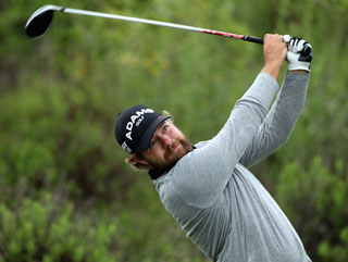 Ryan Moore has a unique swing, an early tee time and a fantastic beard 