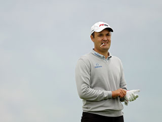 A relaxed and confident Simon Khan will play his part in the 2010 Open