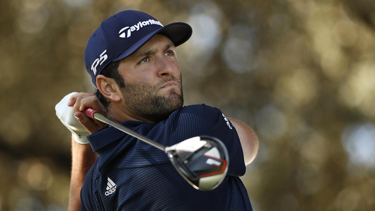 Jon Rahm watches a drive