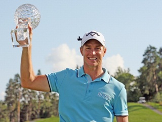 Alex Noren lifts the trophy after a scintillating performance at the Nordea Masters