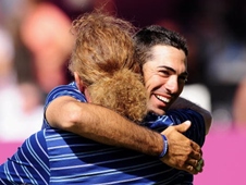 Spaniard Alvaro Quiros enjoys an embrace from compatriot Miguel Angel Jiminez.  Can Quiros triumph at the Madrid Masters this week?