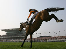 Killygen clears the final fence with style on his way to victory at Aintree in April. Will he repeat at Newbury?