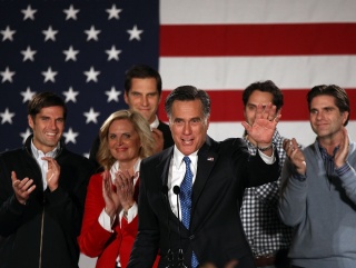 The Romneys are all smiles on a disappointing night