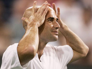 Andre Agassi plays to the crowd during an exhibition match but successful and popular American players have been far and few between since his retirement 