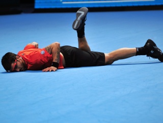Tipsarevic take a tumble against Berdych