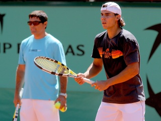Toni Nadal watches his nephew in training